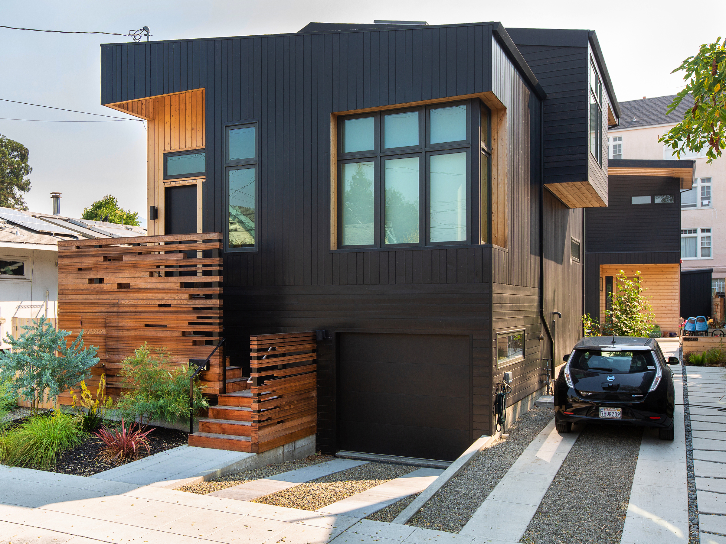two houses clad in black stained cedar